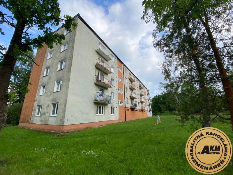 Apartment building on Mierová Street in Čadca with an adjacent green area.