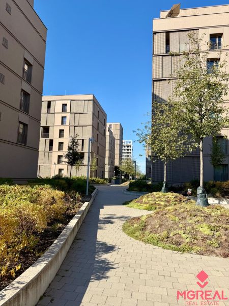 Apartment buildings on Račianska Street in Bratislava - Nové Mesto with landscaped greenery.