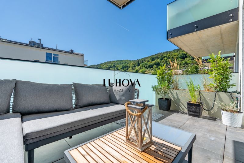 Terrace with outdoor seating on Dlhé lúky in Púchov, view from a 3-room apartment.