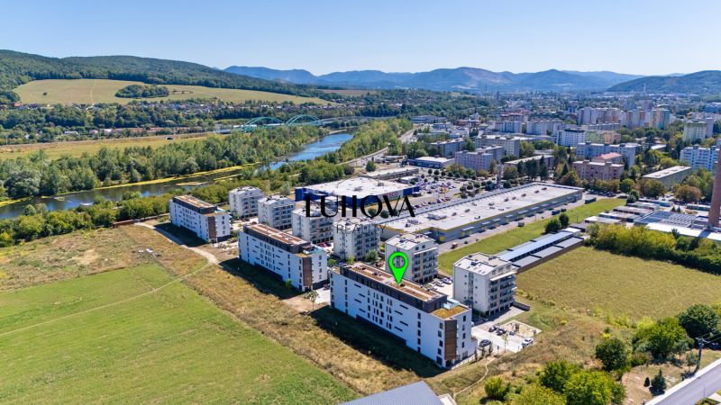 Aerial view of the Dlhé lúky area, Púchov with apartment buildings and surrounding nature, suitable for a 3-room apartment.