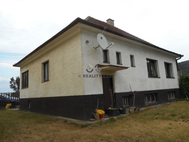A family house in Trenčín with a simple facade and a satellite dish on the property.