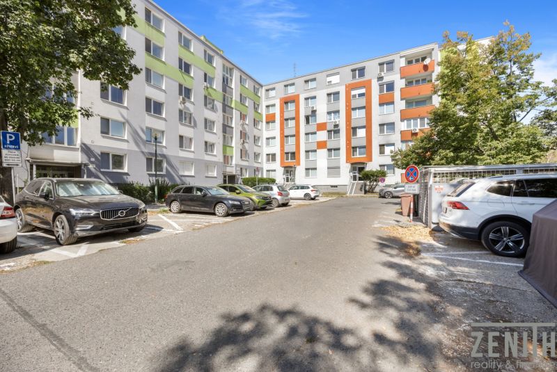 Parking in front of residential buildings on Čiližská Street in Bratislava, Vrakuňa district.