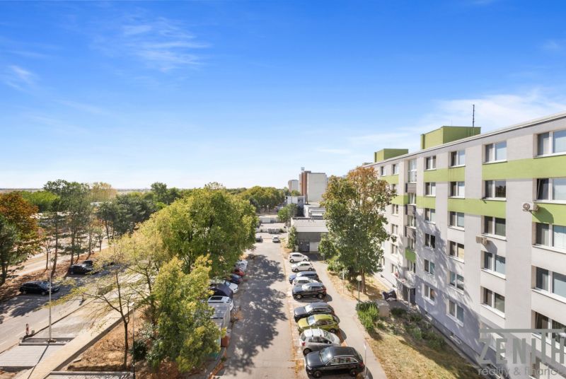 A view of the housing estate with a parking lot and greenery, Bratislava - Vrakuňa, Čiližská Street.