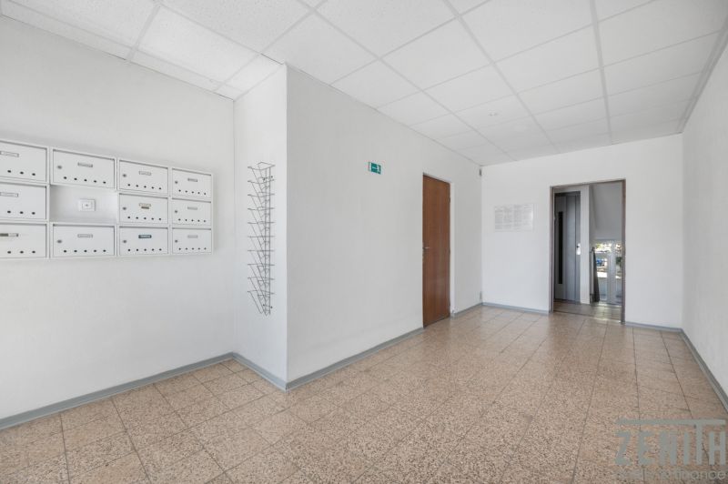 Apartment entrance with mailboxes and doors in Bratislava on Čiližská Street.