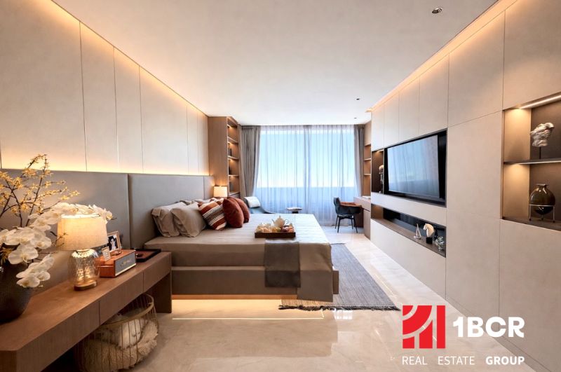 A bedroom in a 3-room apartment with soft lighting and a wooden decor floor.