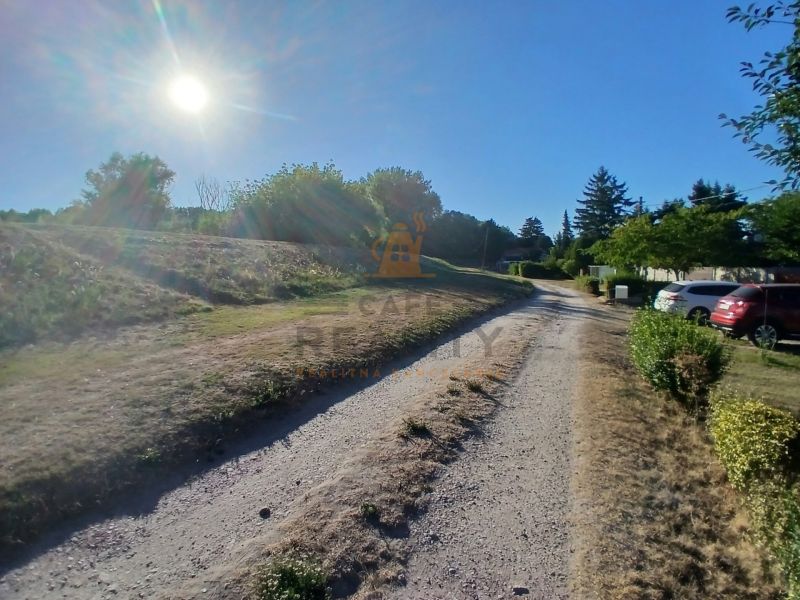 Sunny day in the village of Vojka nad Dunajom, Residential plots with access road.