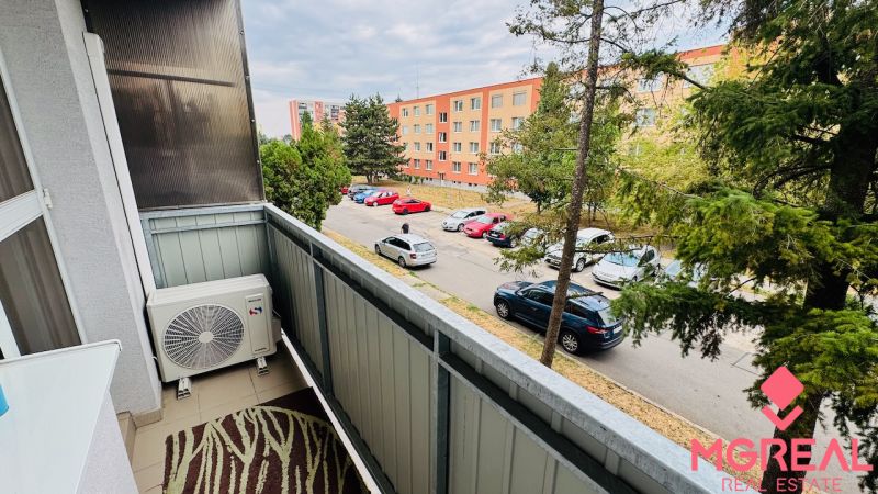 Balcony with air conditioning and a view of Malá okružná street in Partizánske, at a 3-room apartment.