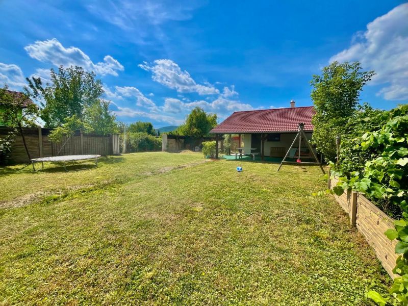 Gardens at Žabí majer in Bratislava - Rača with a small house, swing, and lawn.