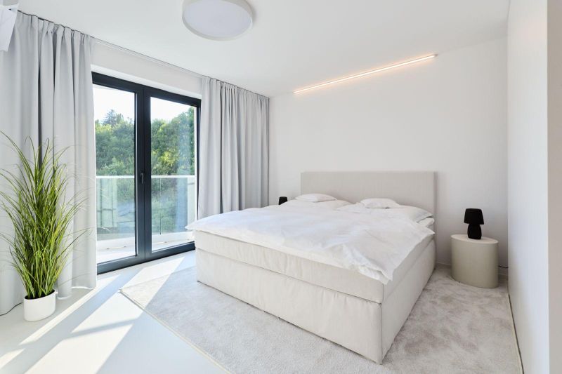A bedroom with a light bed, curtains, carpet, and a balcony in a 4-room apartment.