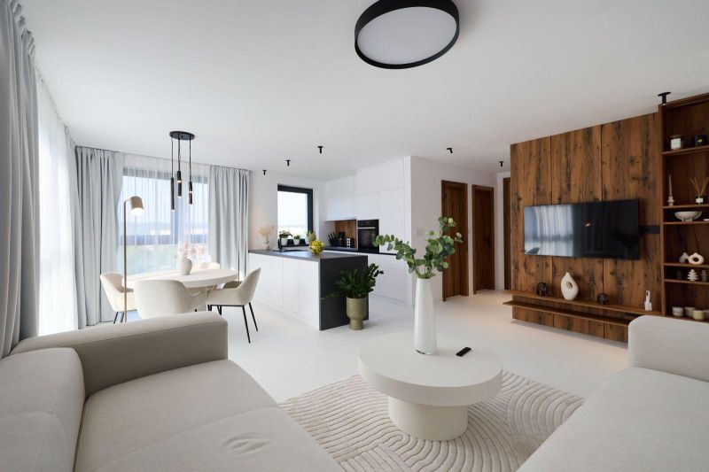 Living room in a 4-room apartment with a wooden decor floor, light furniture, and decorations.