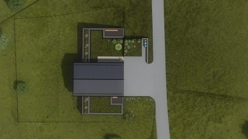 A top view of a family house in Staškov surrounded by grass and a garden.
