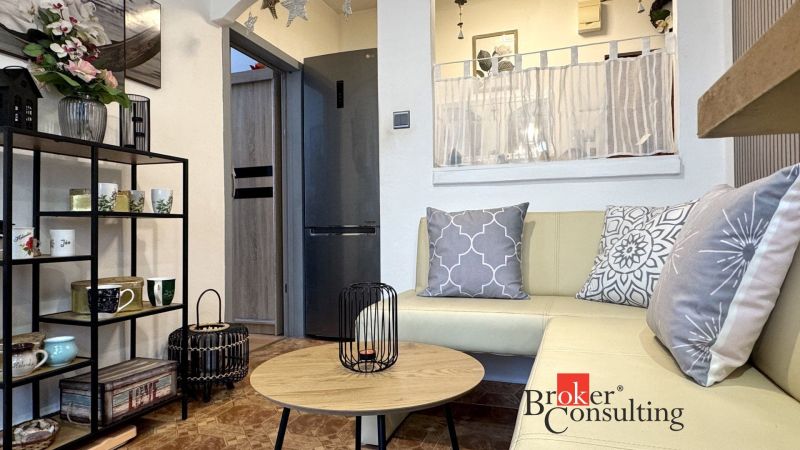 Living room with comfortable seating and decorative pillows in a 3-room apartment.
