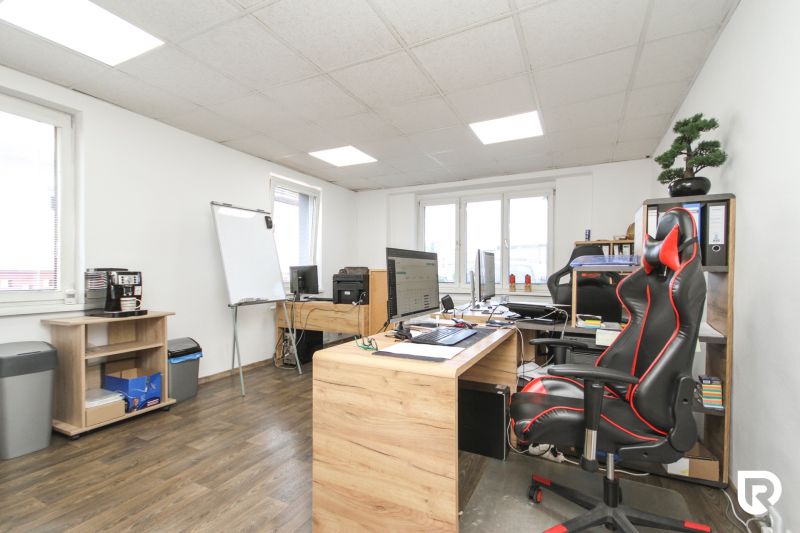Interior of a family house with an office, wooden floor decor, white walls, office equipment.