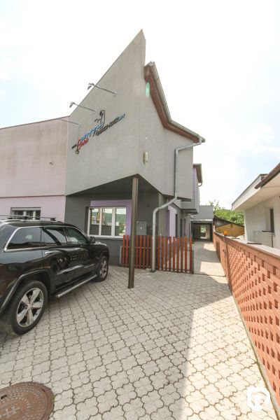 Entrance area of a family house on Kubranská Street in Trenčín with parking for cars.