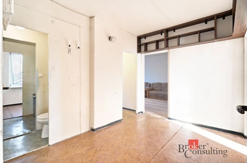 Interior with wood-patterned flooring in a 2-room apartment, view of the room.