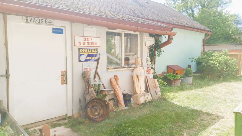 A family house in Rožňava with a separate entrance, decorated with ornaments and metal signs.