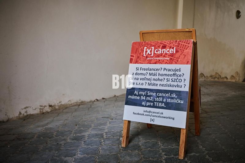 Office space for rent on a floor with tiles.