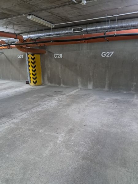 Underground parking with marked spots G27, G28 on Štefánikova Street in Poprad.
