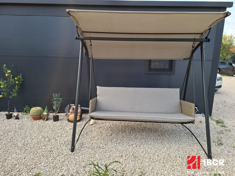 Recreational apartment in Sukošan: garden swing surrounded by plants on a gravel surface.