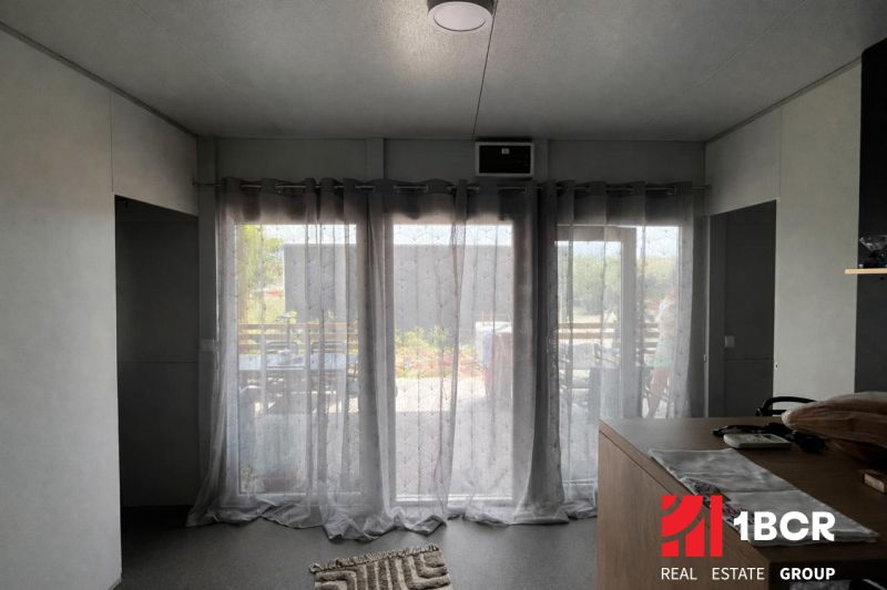 Recreational apartment with blackout curtains and garden view.