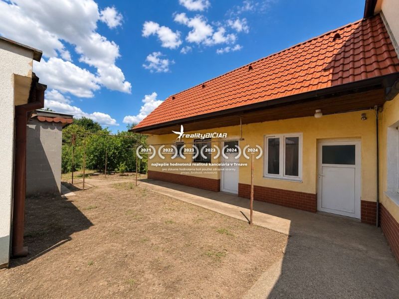 A family house on Orechova Street in Brestovany with a garden and a red roof.