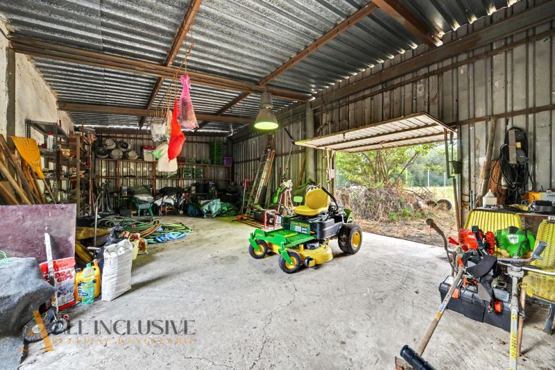 A family house in Lipov with a garage full of tools and a lawnmower.