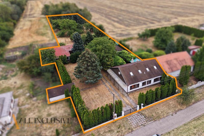A family house in Lipové with a large plot, garden, and dense greenery.