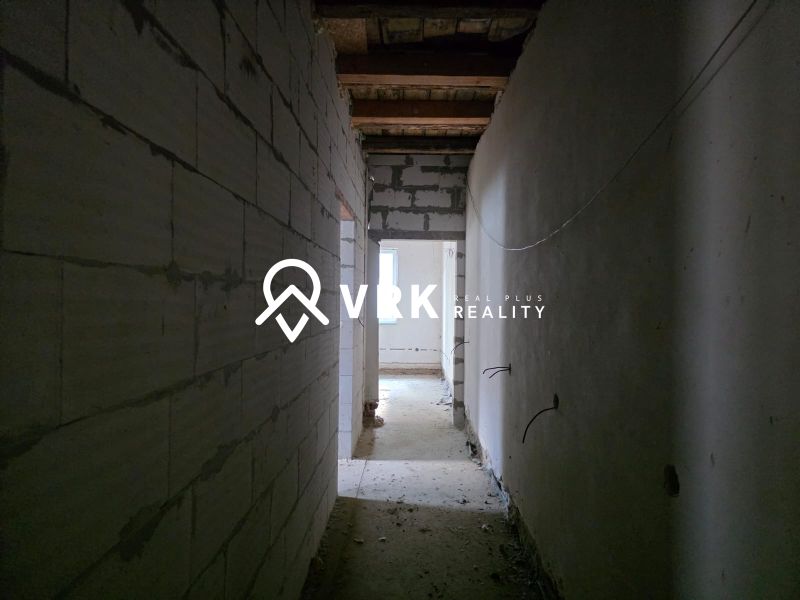 A corridor with thick walls in a family house.