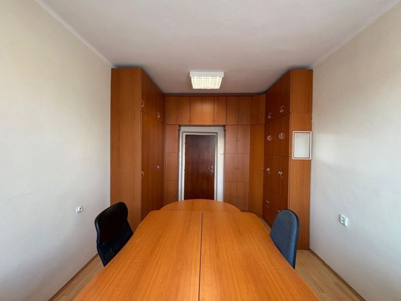 Offices with wooden cabinets and wood-decor flooring.