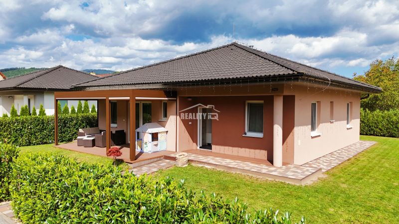 A family house in Bytča with a terrace, landscaped garden, and children's playground.