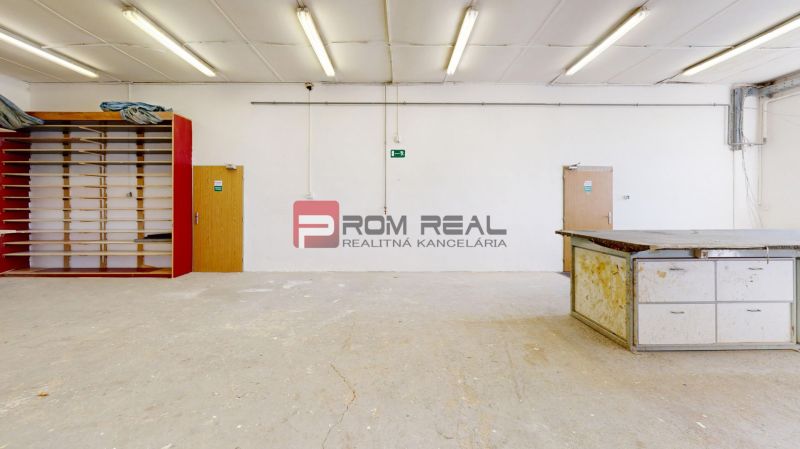 Production premises with shelves and a workbench, floor with wooden decor.