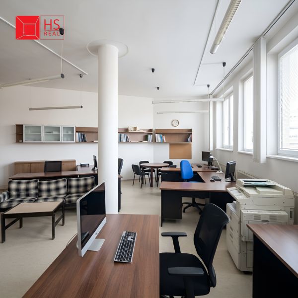Offices with wooden decor furniture, desks, and computers.