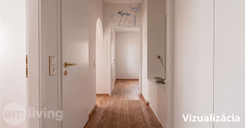 Interior of a 2-room apartment with a wooden decor floor and decorative details on the wall.