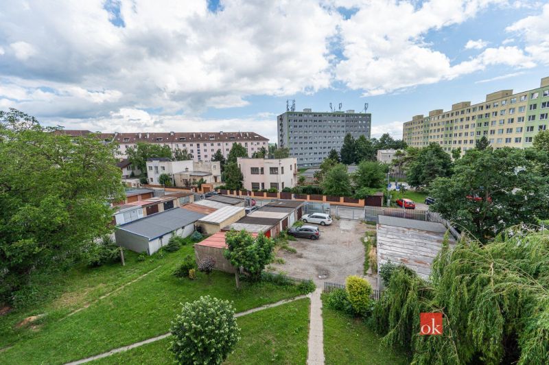 View of residential buildings and garages on Palackého Street in Košice.