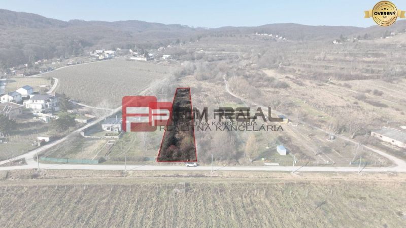 Aerial view of a plot in the gardens of Bratislava III, surrounded by forests and vineyards.