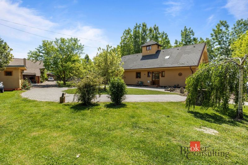 A family house in Hamuliakovo with a spacious garden and a paved driveway.