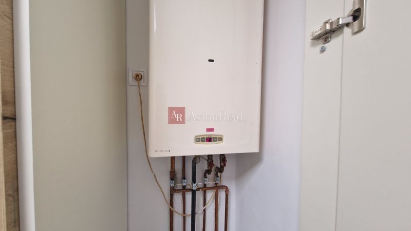 Heating in a 3-room apartment with a boiler and connection to the electrical grid.