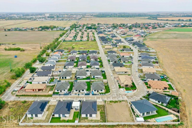 Aerial view of a residential area near the South Gate in Senec with visible houses and roads.