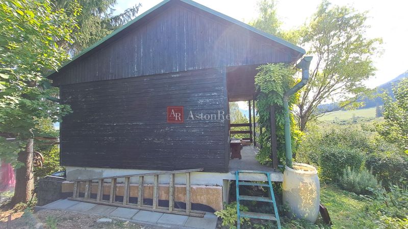 A house on Do Žlebín Street in Ružomberok, surrounded by greenery and natural environment.