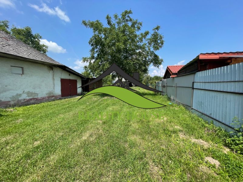 A garden on a residential property on Hlavná Street in Michalovce with a grassy area.