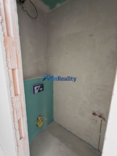 Unfinished toilet in a 3-room apartment with basic plumbing.