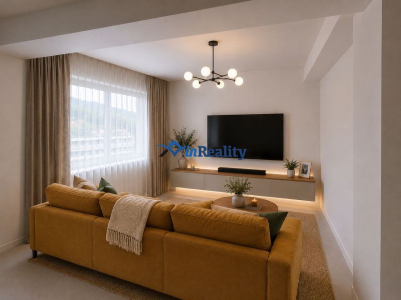 Living room in a 3-room apartment with a yellow sofa, television, and decorations.