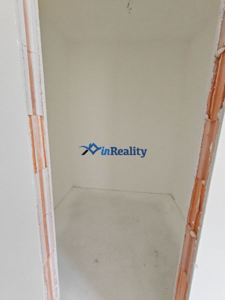 A small storage room in a 3-room apartment with white walls.