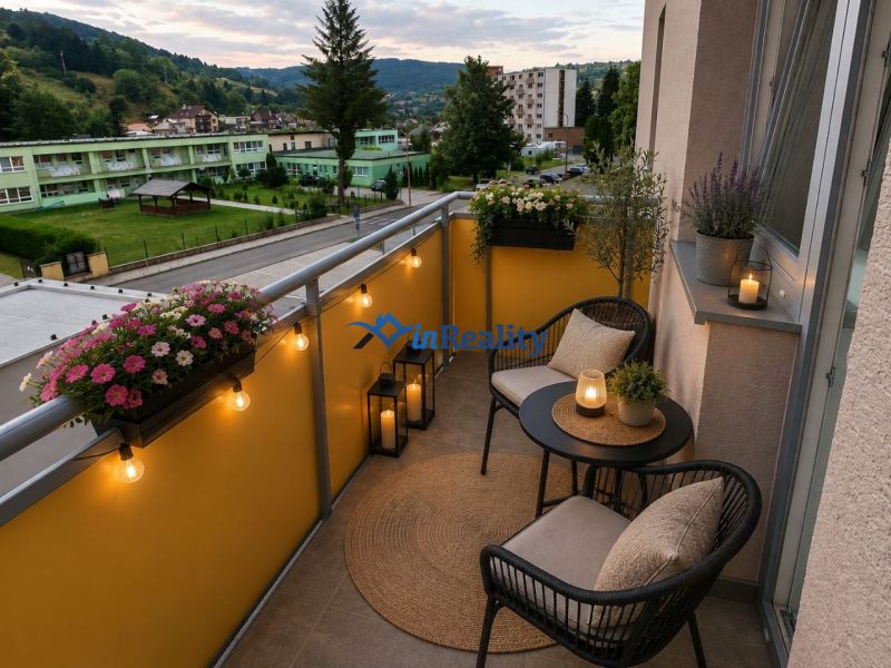 The balcony of a 3-room apartment on Školská Street in Hriňová, evening lighting, flowers, and candles.