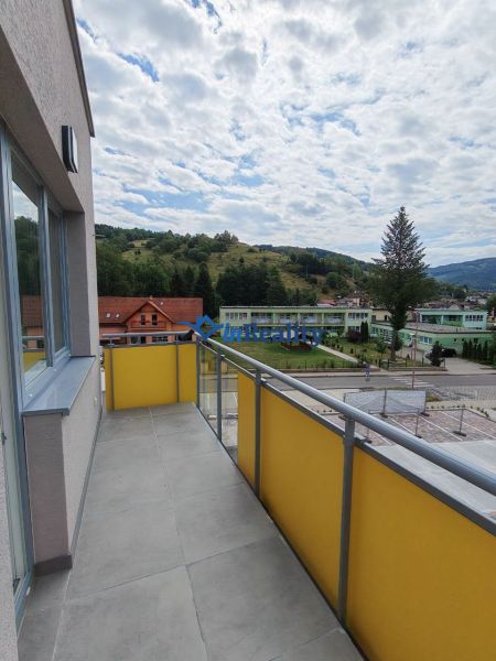 The balcony of a 2-room apartment on Školská Street in Hriňová with a view of the hills.