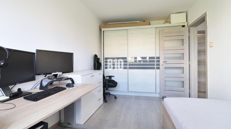 Office in a 3-room apartment with a computer, ergonomic chair, and wardrobe.