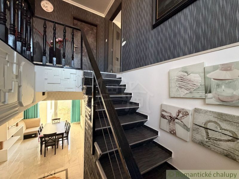 Wooden staircase and decorations in the interior of a family house.