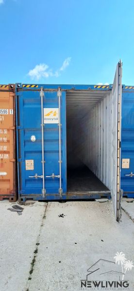 An open blue shipping container on a concrete surface in the warehouses and halls of Sokolovce.