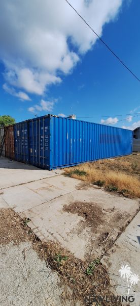 Storage containers outdoors in Sokolovce under a blue sky.