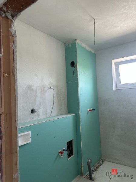 Bathroom in a 2-room apartment with ongoing installation and preparation for modifications.